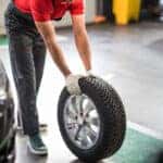 Technician installing new Mazda tires
