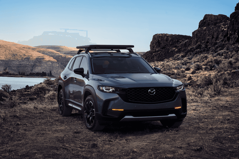 The Mazda CX-50 driving on rough terrain
