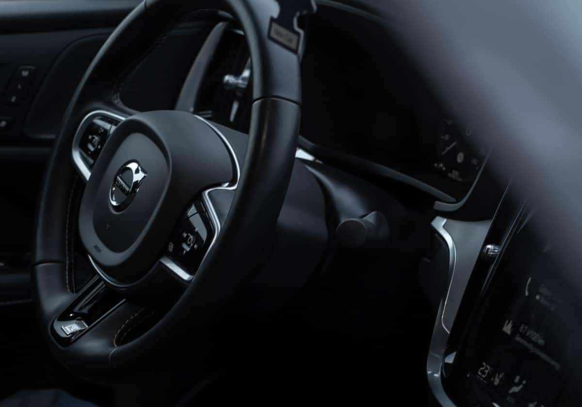 up close of volvo steering wheel and dash board