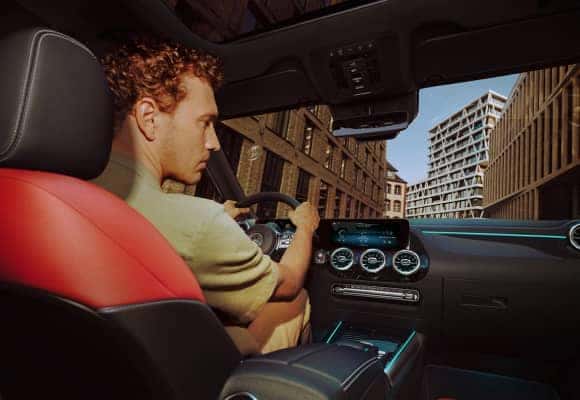 Man driving through city
